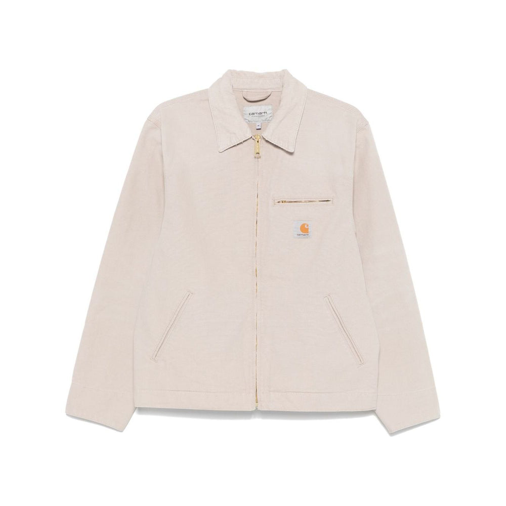 CARHARTT WIP MAIN Jackets Beige, sand beige canvas jacket with front zip fastening and pockets, displayed against a white background.