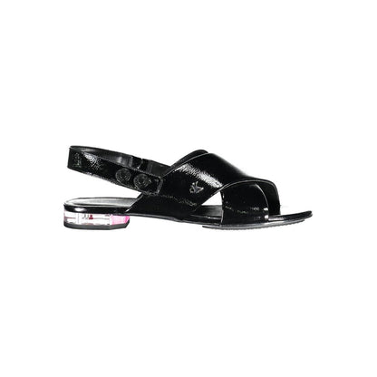 Calvin Klein Black Leather Women Sandal with crossed front design and subtle heel showcasing minimalist elegance.