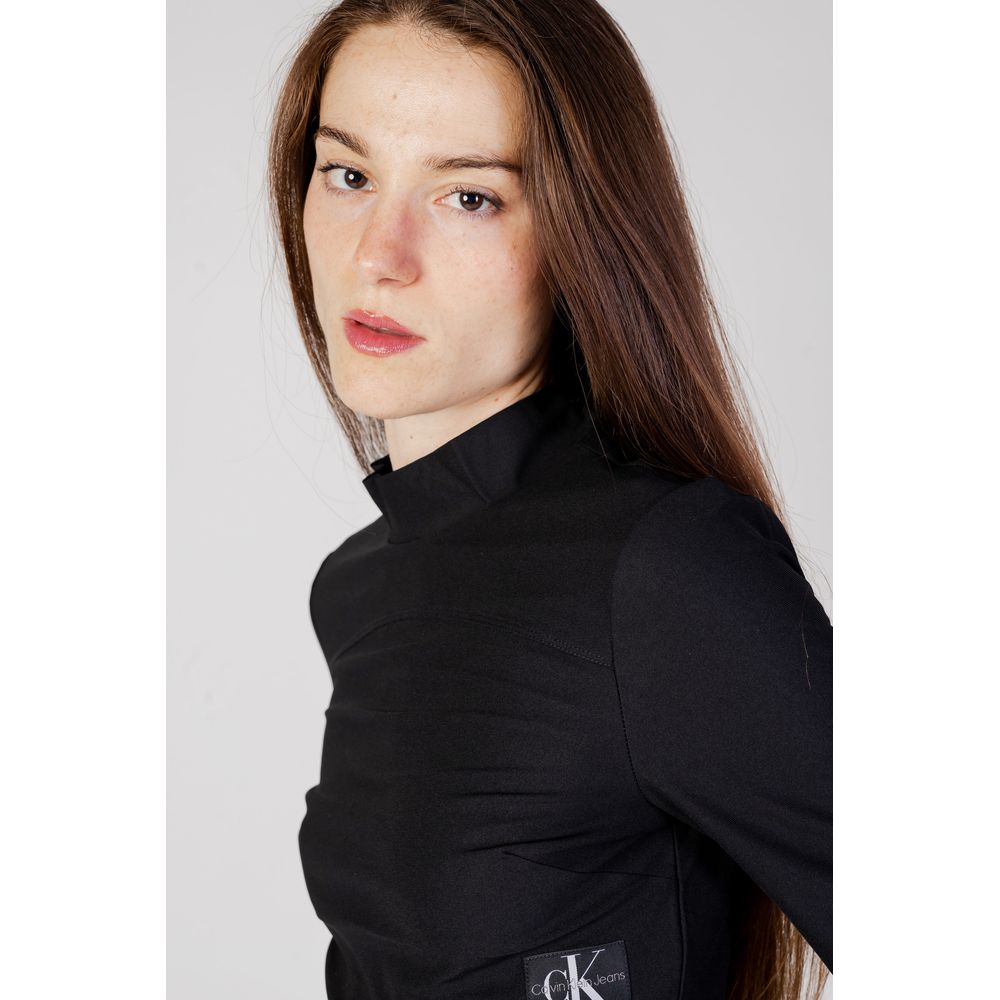 Woman wearing Calvin Klein Jeans Black Recycled Polyester Top with high collar and long sleeves
