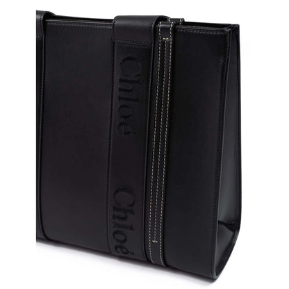 Chloé Black Woody Embroidered Logo Leather Medium Tote Bag, showcasing handle details and elegant design, perfect for stylish outings.