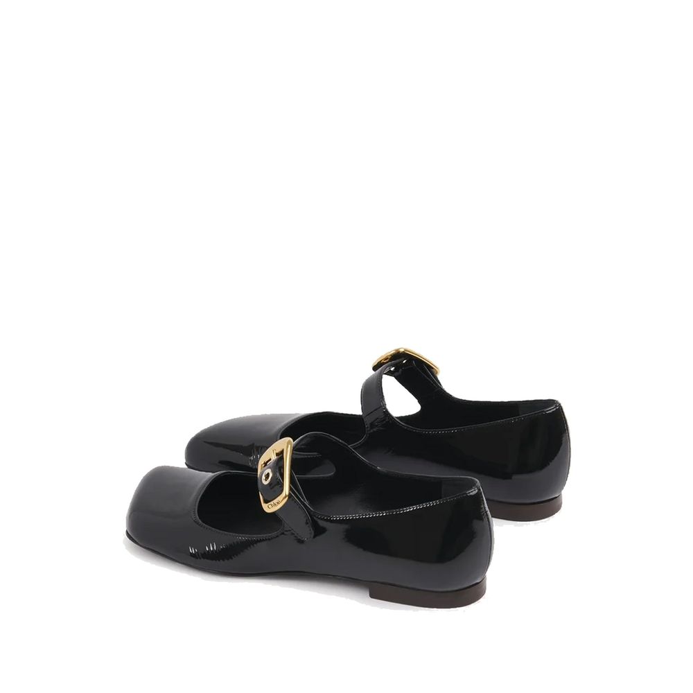 Chloé Chloè Mary-Jane Polly Ballerina Flats in black patent leather with gold buckle, asymmetrical toe, and branded insole