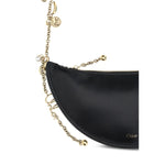 Close-up of Chloé Icons Shoulder Bag in lambskin nappa leather with gold chain and charms.