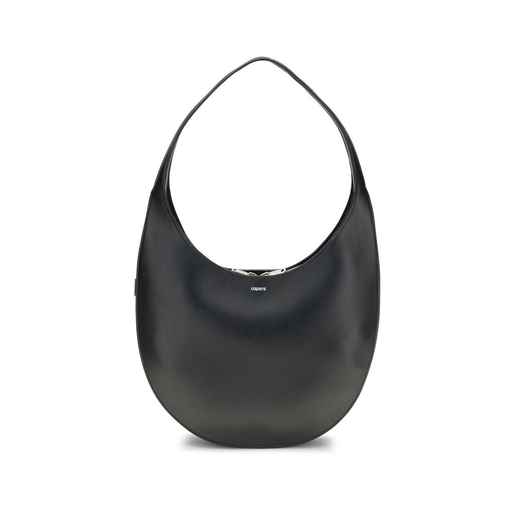 Coperni Black Leather Shoulder Bag with smooth hobo silhouette and futuristic zip closure, featuring contrasting logo on front.