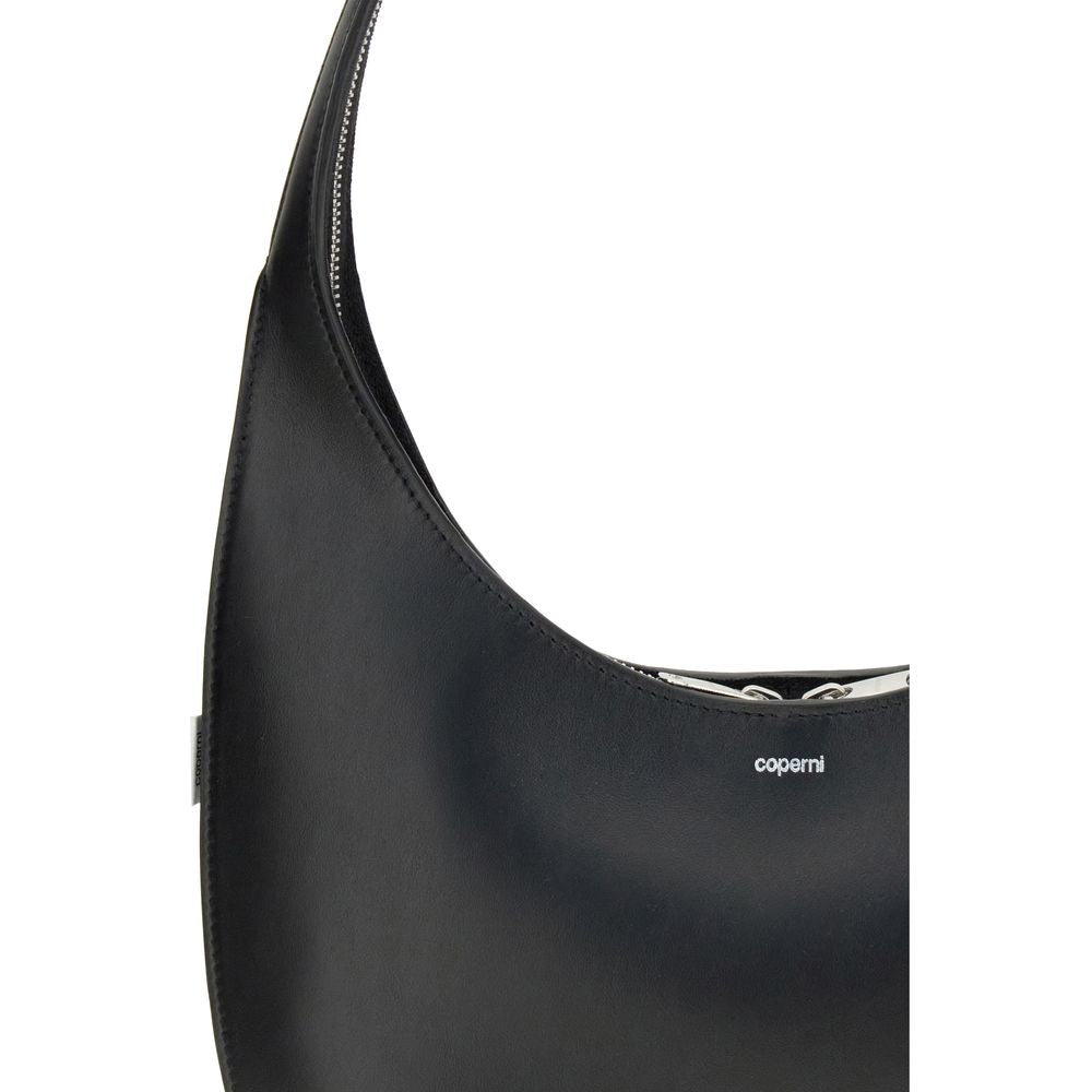 Coperni Black Leather Shoulder Bag with futuristic two-way zip and logo detail, featuring a fluid hobo silhouette.