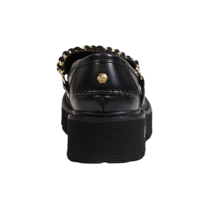 Rear view of Cult Black Leather Platform Pumps with decorative chain and logo emblem, showing chunky treaded sole for stability.