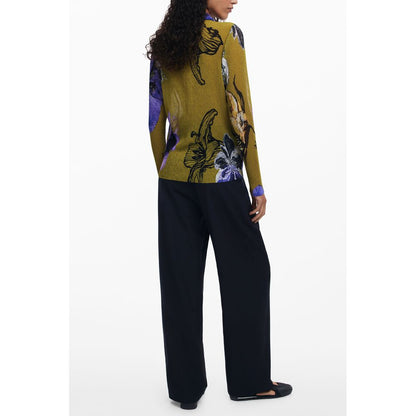 Back view of a woman wearing a Desigual Green Polyester Women Shirt with bold floral design, paired with black trousers.