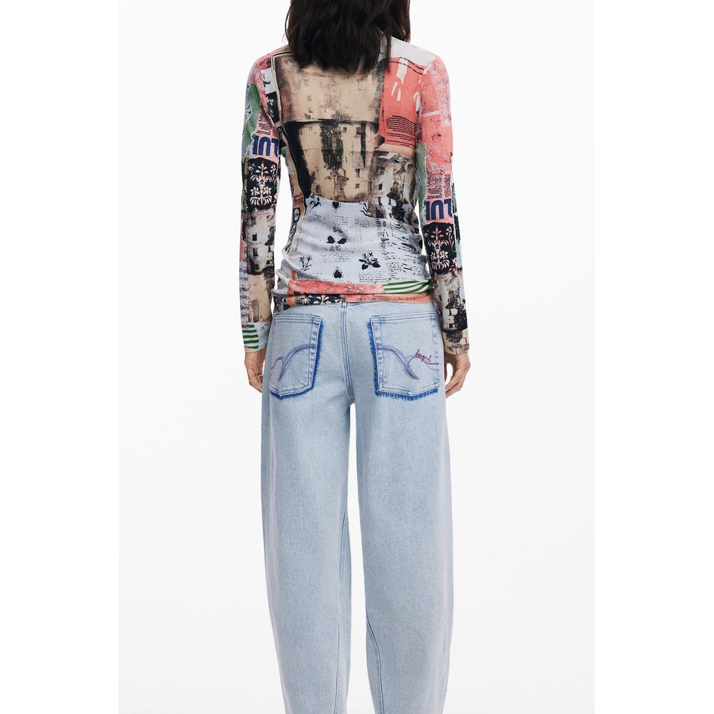 Back view of woman wearing colorful Desigual top and light blue jeans