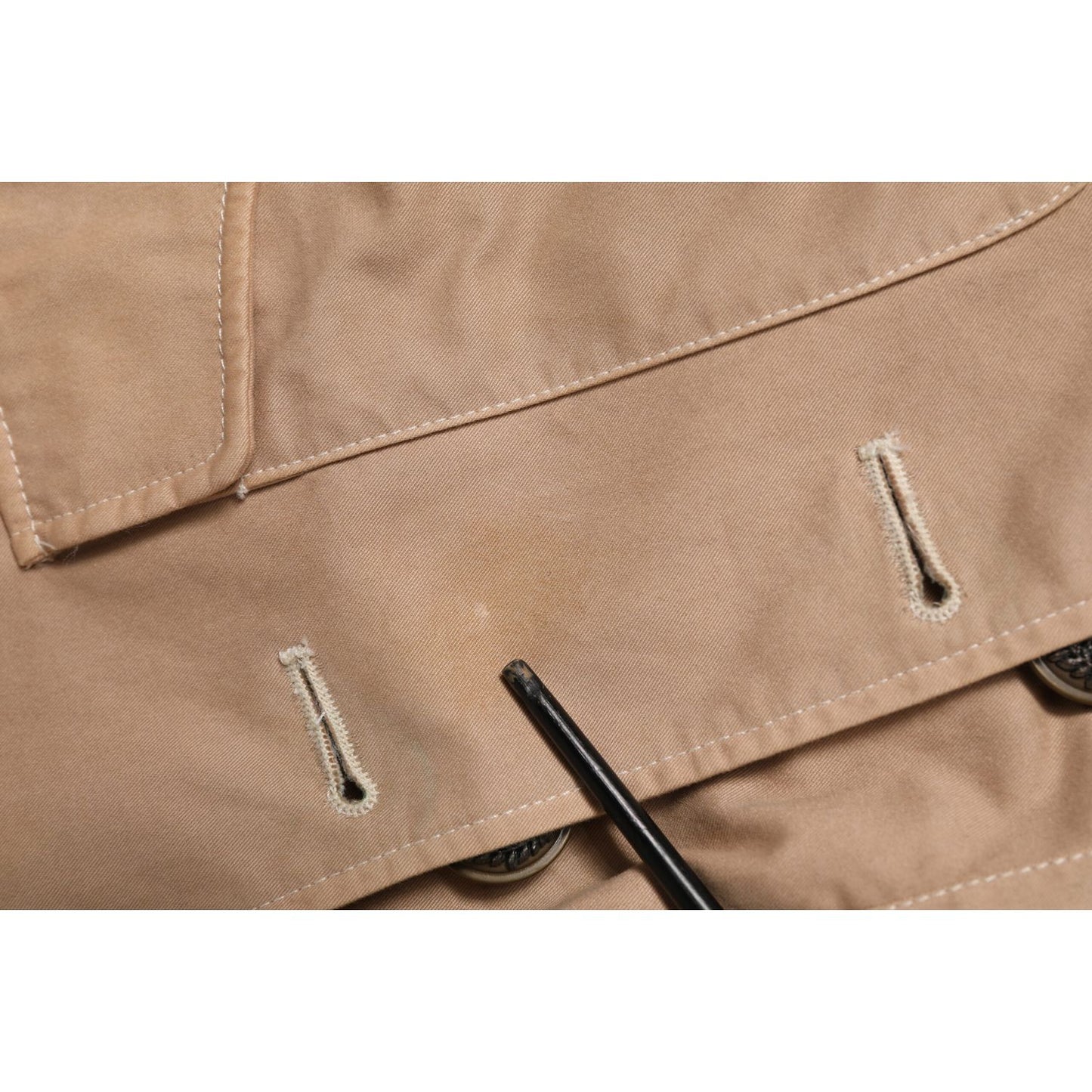 Close-up of Dolce & Gabbana Beige Cotton Button Up Fitted Cropped Jacket detailing with buttons