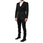 Model wearing Dolce & Gabbana Black 3 Piece Brocade Jacquard Suit MARTINI, featuring floral pattern, ideal for weddings and high-end events.