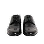 Dolce & Gabbana Black Calfskin Leather Derby Men Dress Shoes front view, elegant lace-up design, perfect for formal attire.