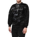 Dolce & Gabbana Black Camouflage Round Neck Sweatshirt Sweater on model, featuring sleek design and bold pattern for urban style