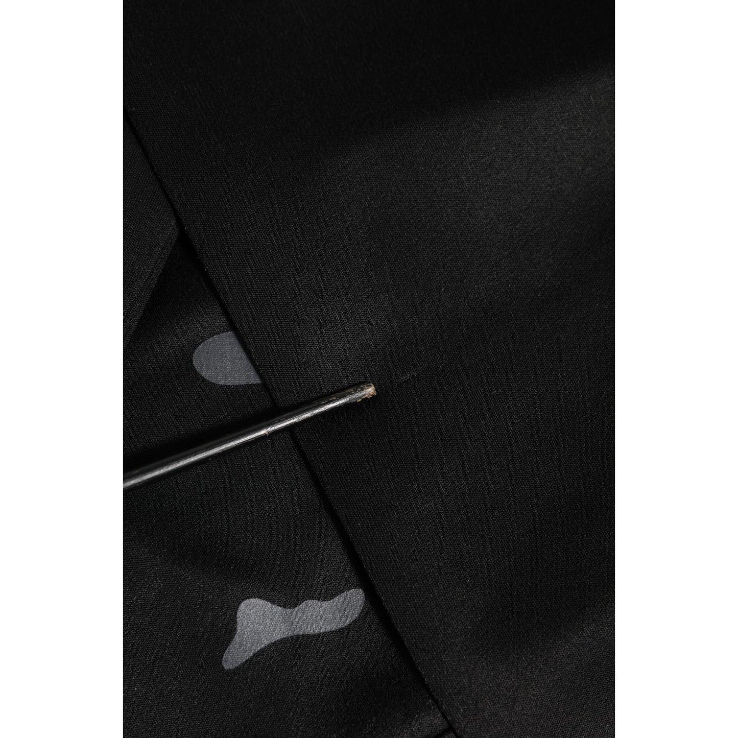Close-up of Dolce & Gabbana Black Camouflage Round Neck Sweatshirt Sweater fabric detail with sleek black material and camouflage pattern.