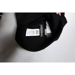 Dolce & Gabbana Black Cashmere DG Logo Square Handkerchief Scarf label and tag detail on a white surface