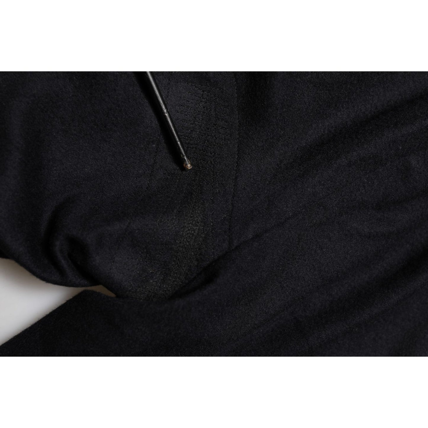 Close-up of Dolce & Gabbana Black Cashmere Dress Formal Men Trouser Pants fabric detail showing luxurious material.