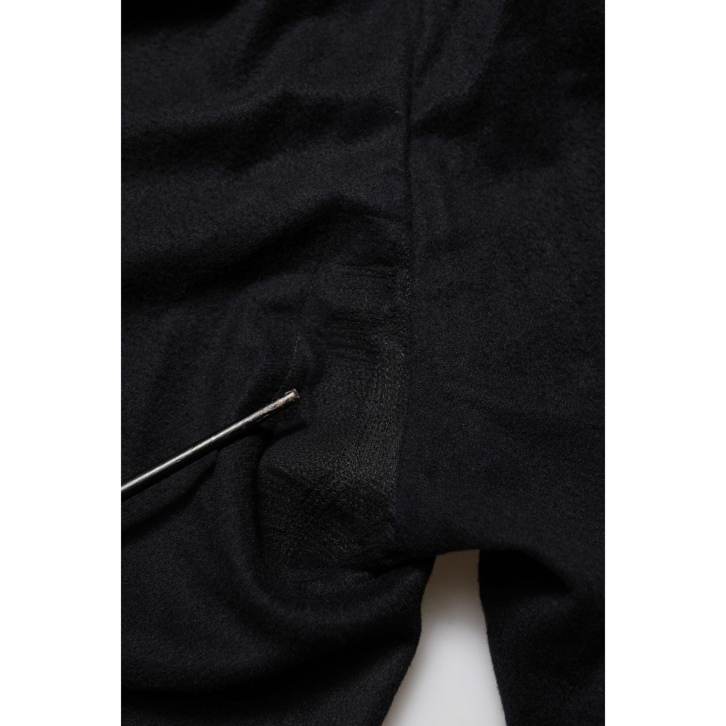 Close-up of Dolce & Gabbana Black Cashmere Dress Formal Trouser Pants, showcasing luxurious fabric and tailored detailing.