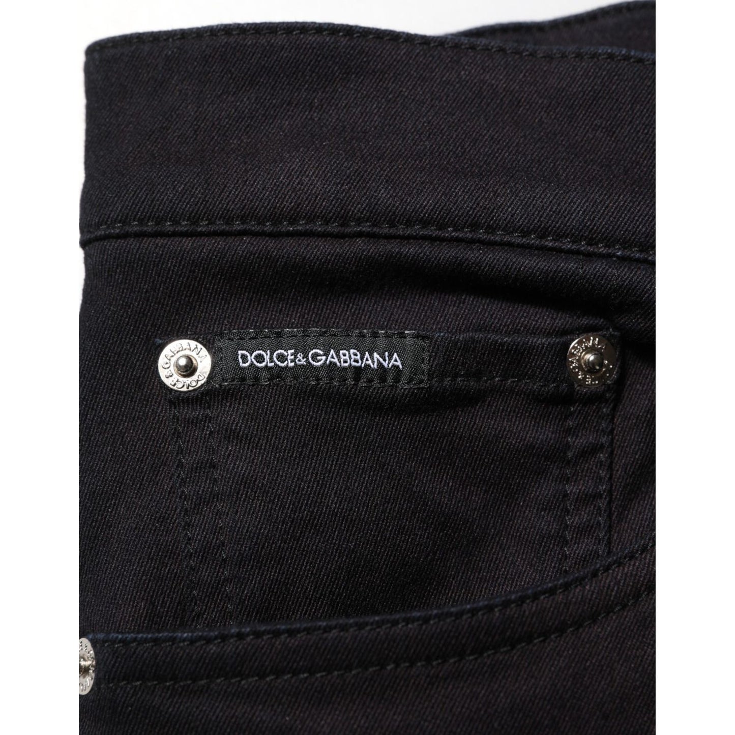 Dolce & Gabbana Black Cotton Blend Skinny Men Trouser Pants with logo detail on pocket and contrast stitching.