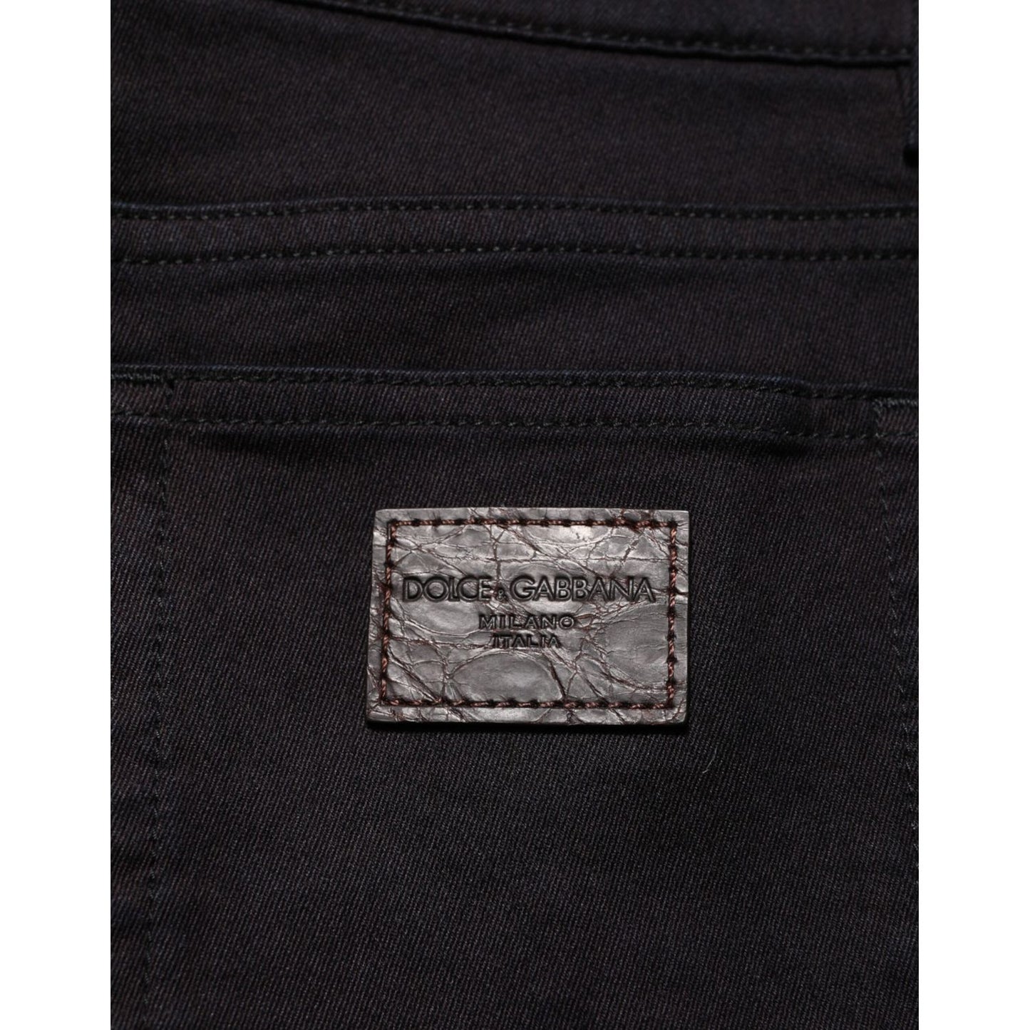 Close-up of Dolce & Gabbana Black Cotton Blend Skinny Men Trouser Pants with logo detail on back pocket.