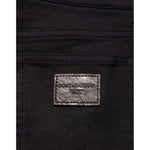 Close-up of Dolce & Gabbana Black Cotton Blend Skinny Men Trouser Pants with logo detail on back pocket.