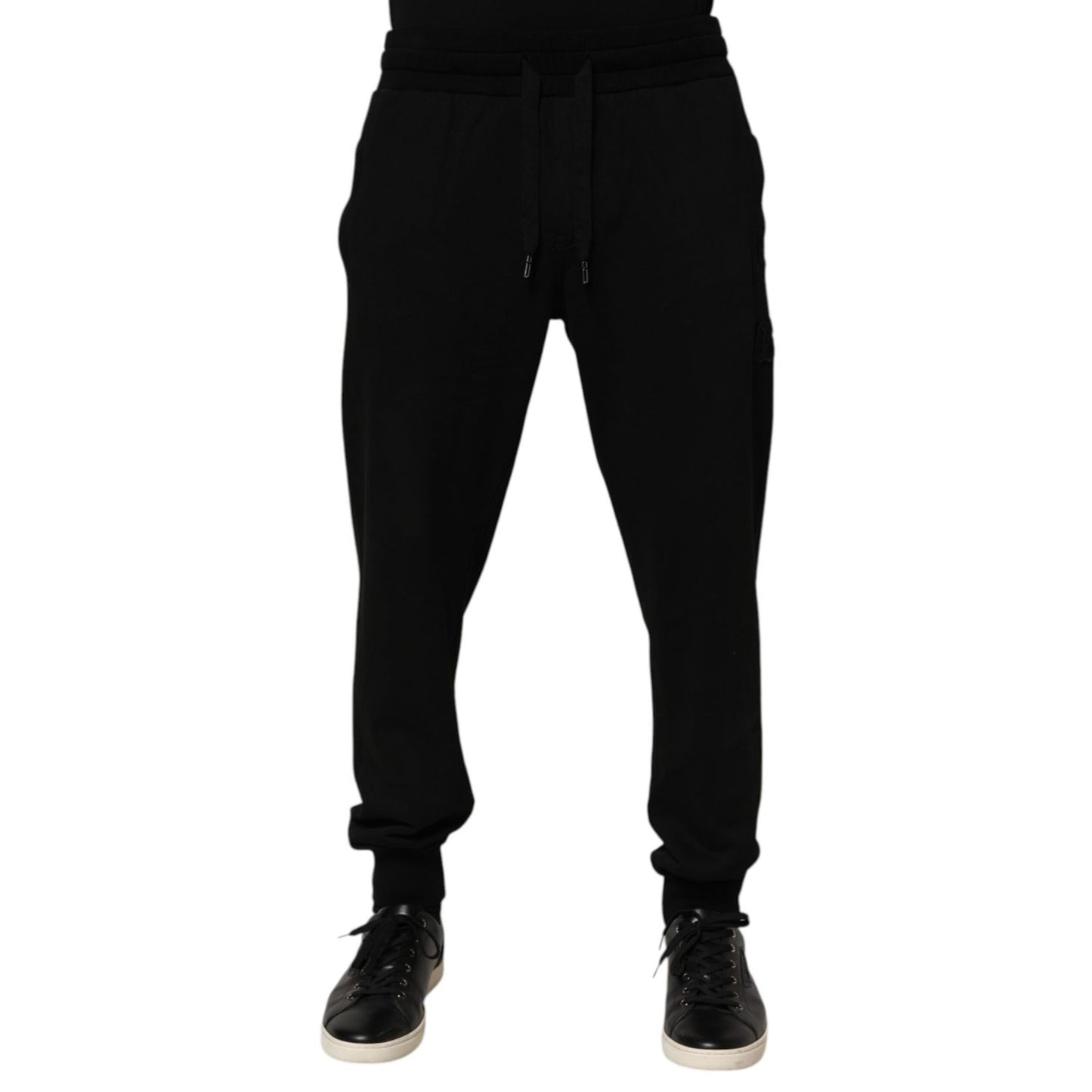Dolce & Gabbana Black Cotton DG Logo Men Jogger Pants with drawstring closure and repaired holes near pocket area.