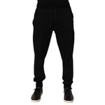 Dolce & Gabbana Black Cotton DG Logo Men Jogger Pants with drawstring closure and repaired holes near pocket area.