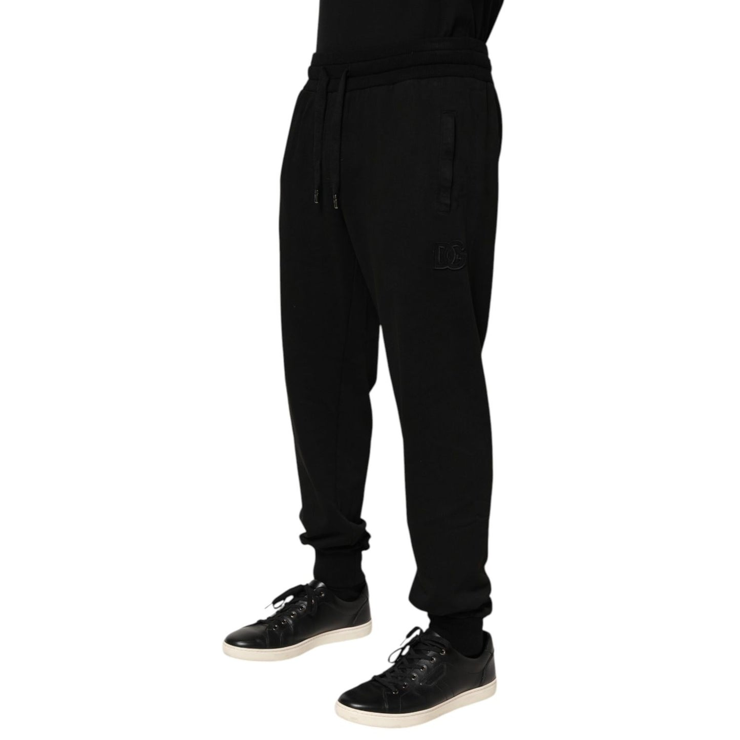 Dolce & Gabbana Black Cotton DG Logo Men Jogger Pants, preowned with drawstring closure and repaired holes near pocket, made in Italy.