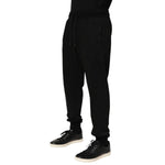 Dolce & Gabbana Black Cotton DG Logo Men Jogger Pants, preowned with drawstring closure and repaired holes near pocket, made in Italy.
