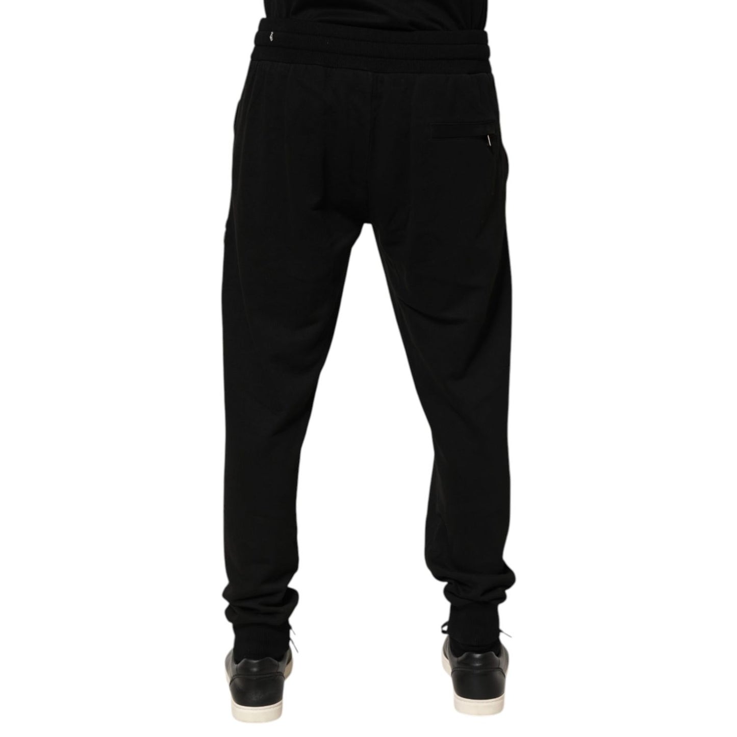 Dolce & Gabbana Black Cotton DG Logo Men Jogger Pants, preowned, back view, showing repaired holes near pocket, 100% cotton, made in Italy.