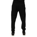 Dolce & Gabbana Black Cotton DG Logo Men Jogger Pants, preowned, back view, showing repaired holes near pocket, 100% cotton, made in Italy.