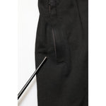 Close-up of Dolce & Gabbana Black Cotton DG Logo Men Jogger Pants showing repaired hole near the pocket area.