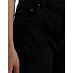 Dolce & Gabbana Black Cotton High Waist Tattered Denim Jeans with zipper closure, logo details, and crafted in Italy.