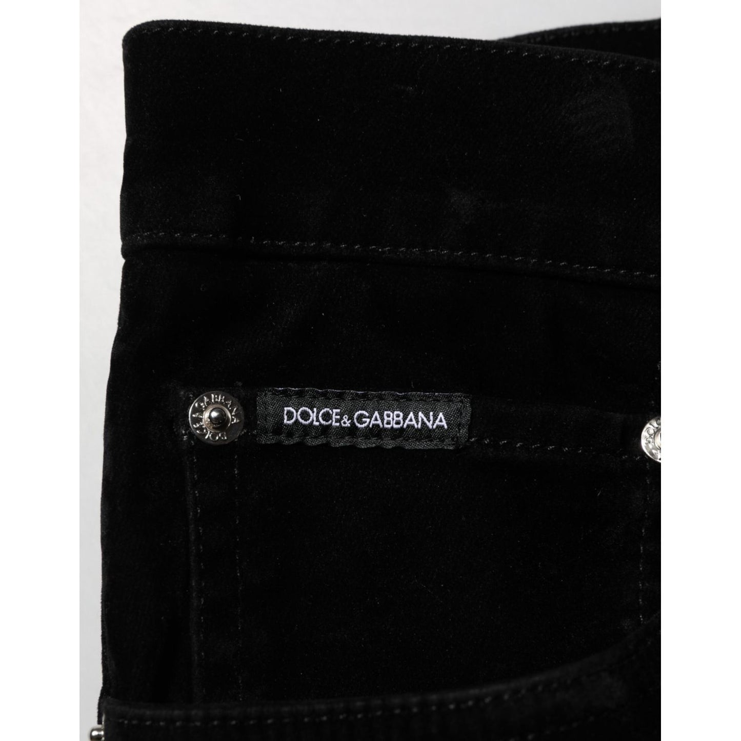 Close-up of Dolce & Gabbana Black Cotton Slim Fit Denim Trouser Jeans with branding on pocket.