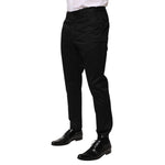 Dolce & Gabbana Black Cotton Tapered Men Formal Trousers Pants on model, highlighting elegant design and slim fit.