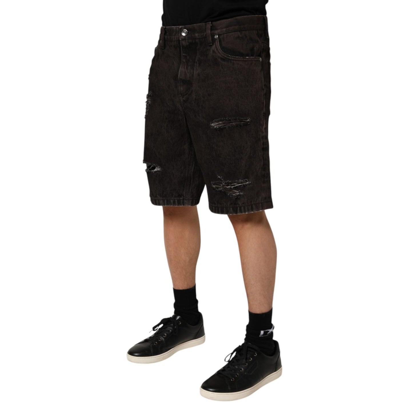 Dolce & Gabbana Black Cotton Tattered Denim Men Bermuda Short with distressed details in premium 100% cotton fabric.
