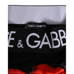 Close-up of Dolce & Gabbana Black Floral Print High Waist Sheer Mesh Underwear waistband with logo and red poppy design.