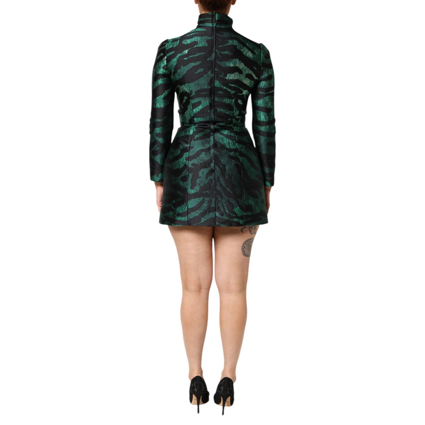 Back view of Dolce & Gabbana Black Green Metallic Jacquard Mini Long Dress, showcasing long sleeves and zipper closure.