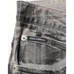 Dolce & Gabbana Black Grey Graphic Print Denim Pants Jeans close-up with logo plaque on pocket