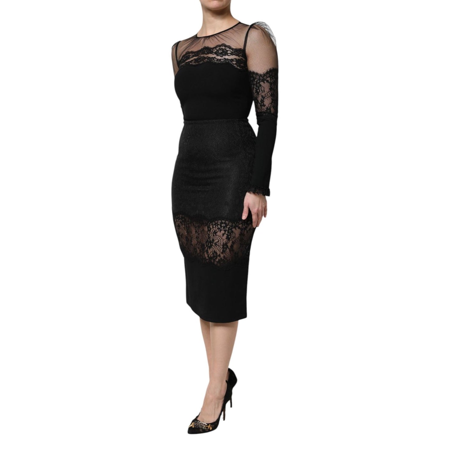 Woman wearing Dolce & Gabbana Black Lace Trim Nylon Tulle SheathMidi Dress, elegant black evening dress with intricate lace trim.