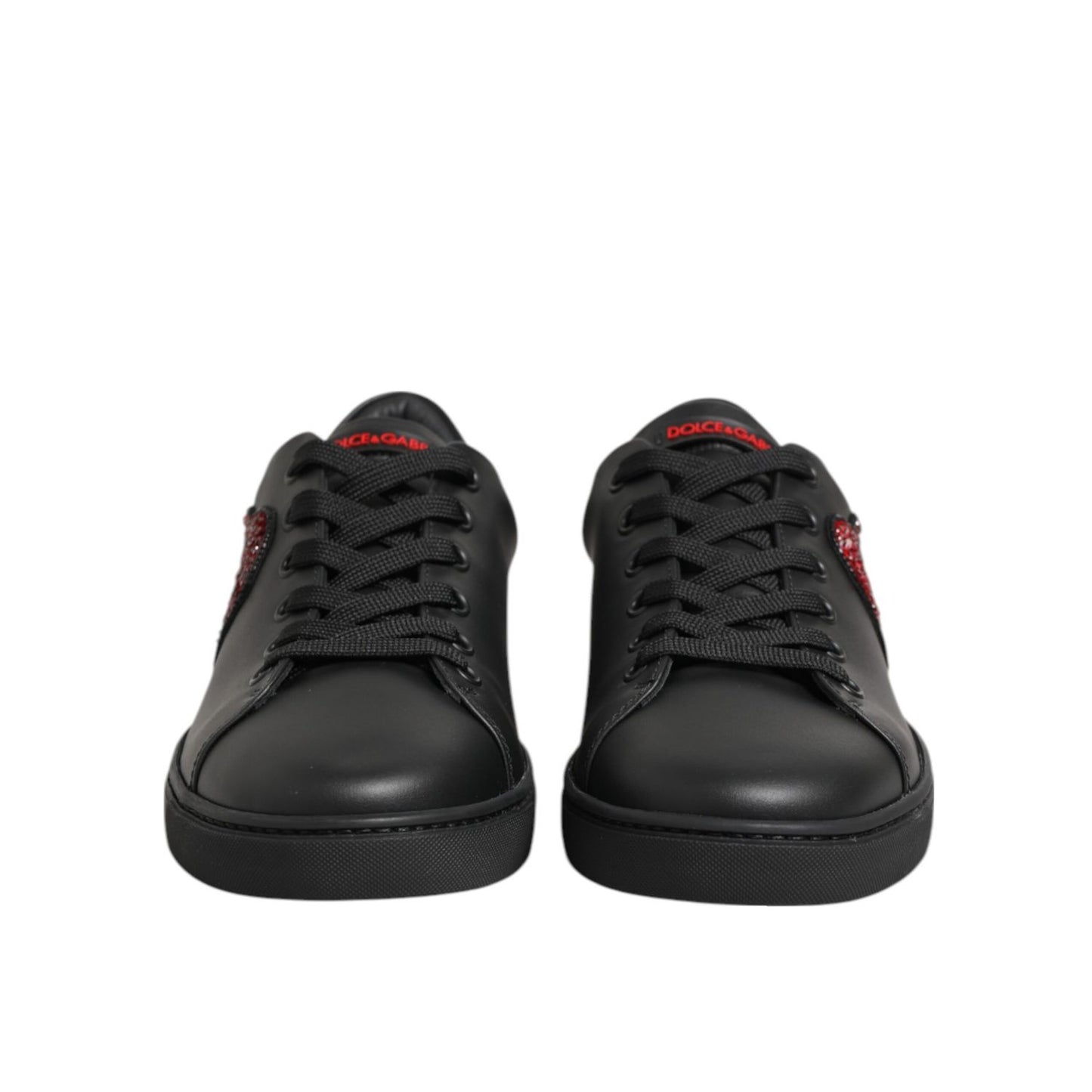 Dolce & Gabbana Black Leather Crystal Heart Low Top Sneakers Shoes with red crystal heart detail on black leather background.
