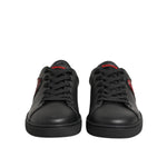 Dolce & Gabbana Black Leather Crystal Heart Low Top Sneakers Shoes with red crystal heart detail on black leather background.