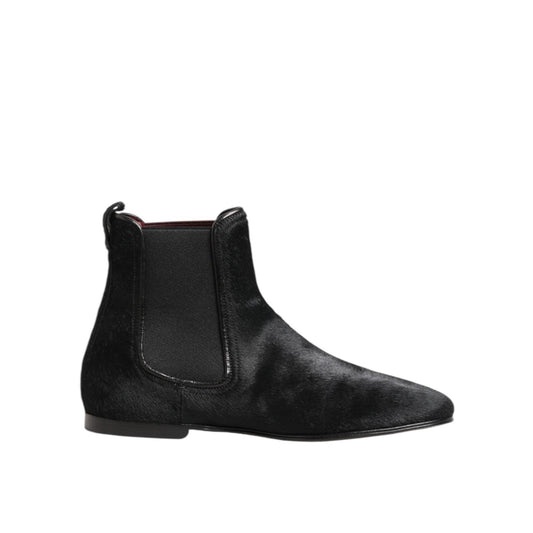 Dolce & Gabbana Black Leather Fur Men CHELSEA Boots Shoes with elastic side panels and plush fur lining, side view.