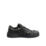 Dolce & Gabbana Black Leather Studded Low Top Sneakers Shoes with metal studs and rubber soles, side view.