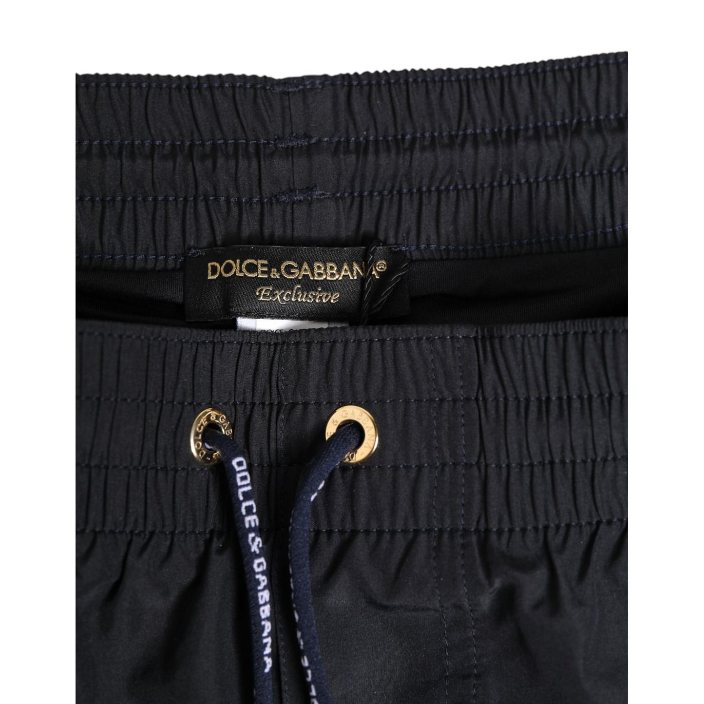 Dolce & Gabbana Black Nylon Side Logo Tape Shorts Swimwear with drawstring waistband and logo details.