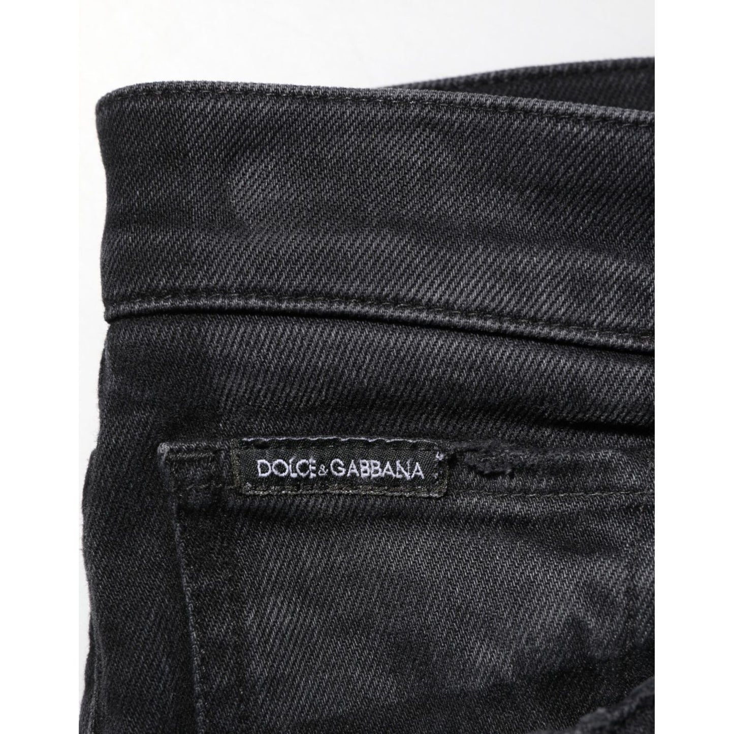 Dolce & Gabbana Black Slim Fit Stretch Men Denim Pants Jeans with logo detail on waistband, close-up view.