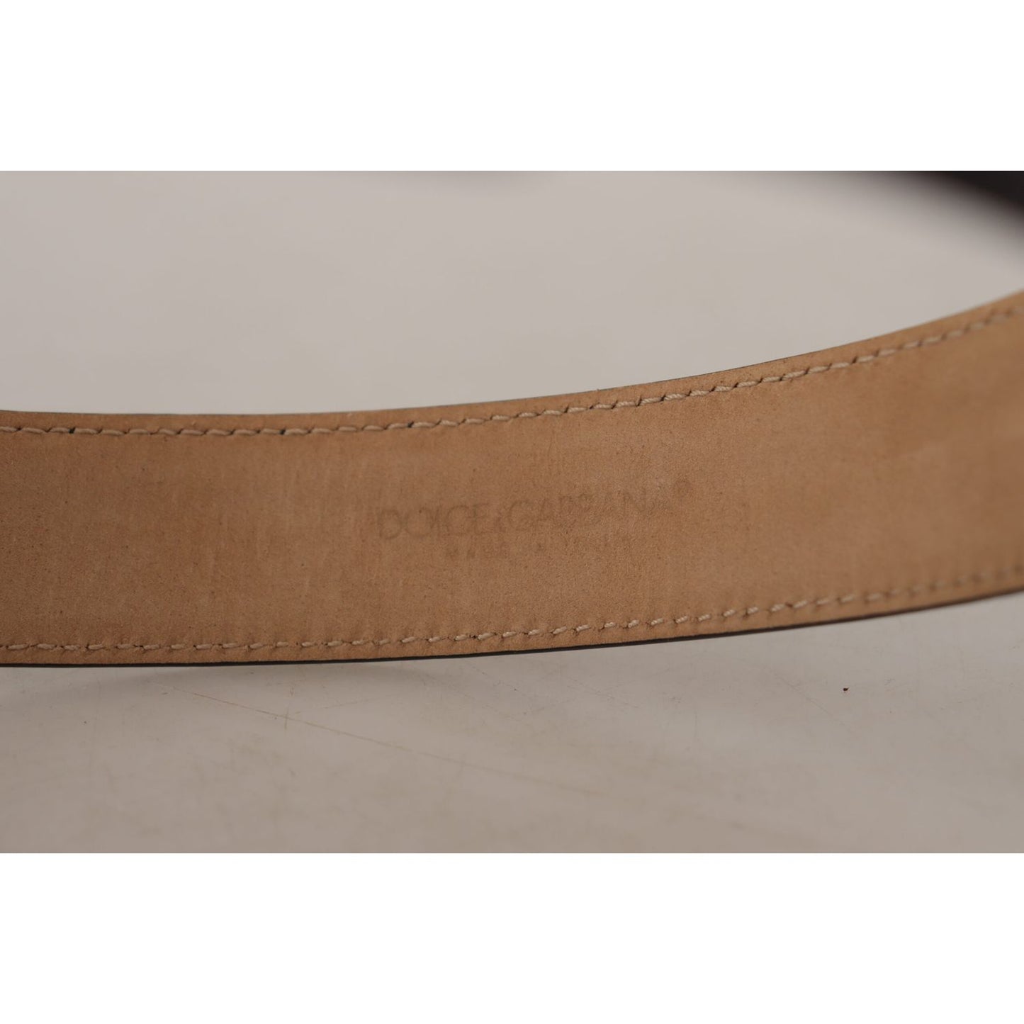 Dolce & Gabbana Black Solid Leather Classic Gold Waist Buckle Belt showcasing stitched details and partial logo engraving.