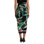 Back view of Dolce & Gabbana Black Strelitzia High Waist Wrap Midi Skirt with floral pattern and zipper closure, worn by model.