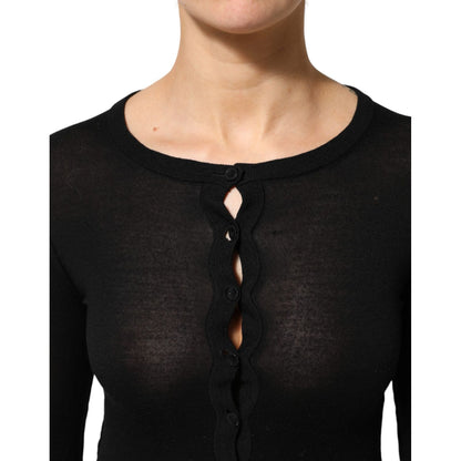 Close-up of a Dolce & Gabbana Black Virgin Wool Buttoned Cardigan Sweater showcasing button detail and neckline.