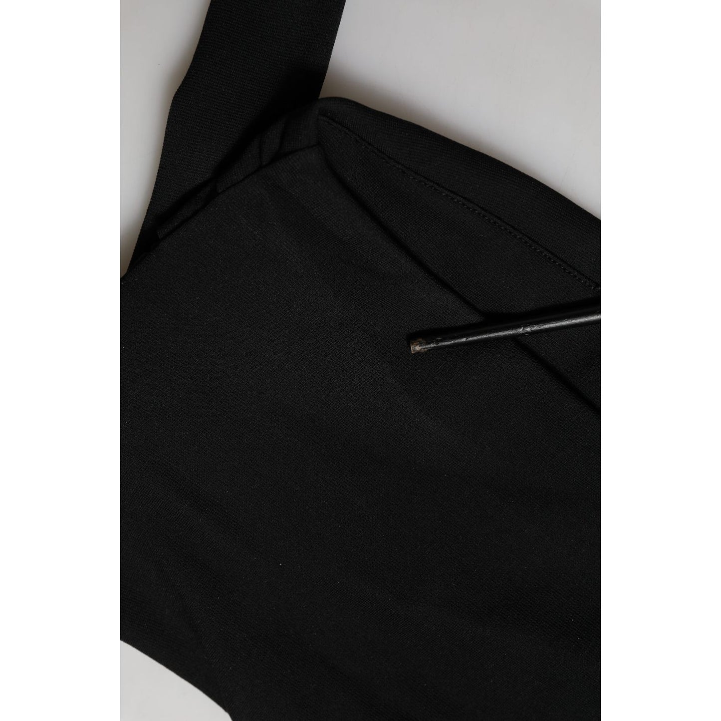 Close-up of Dolce & Gabbana Black Viscose Halter Off Shoulder Cropped Top with smooth black fabric and elegant design features.