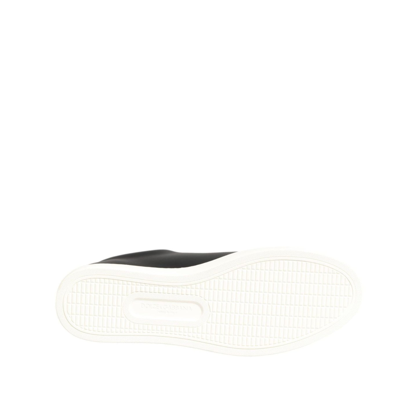 Sole view of Dolce & Gabbana Black White Leather Crystal Heart Sneakers Shoes in black leather with white rubber base.