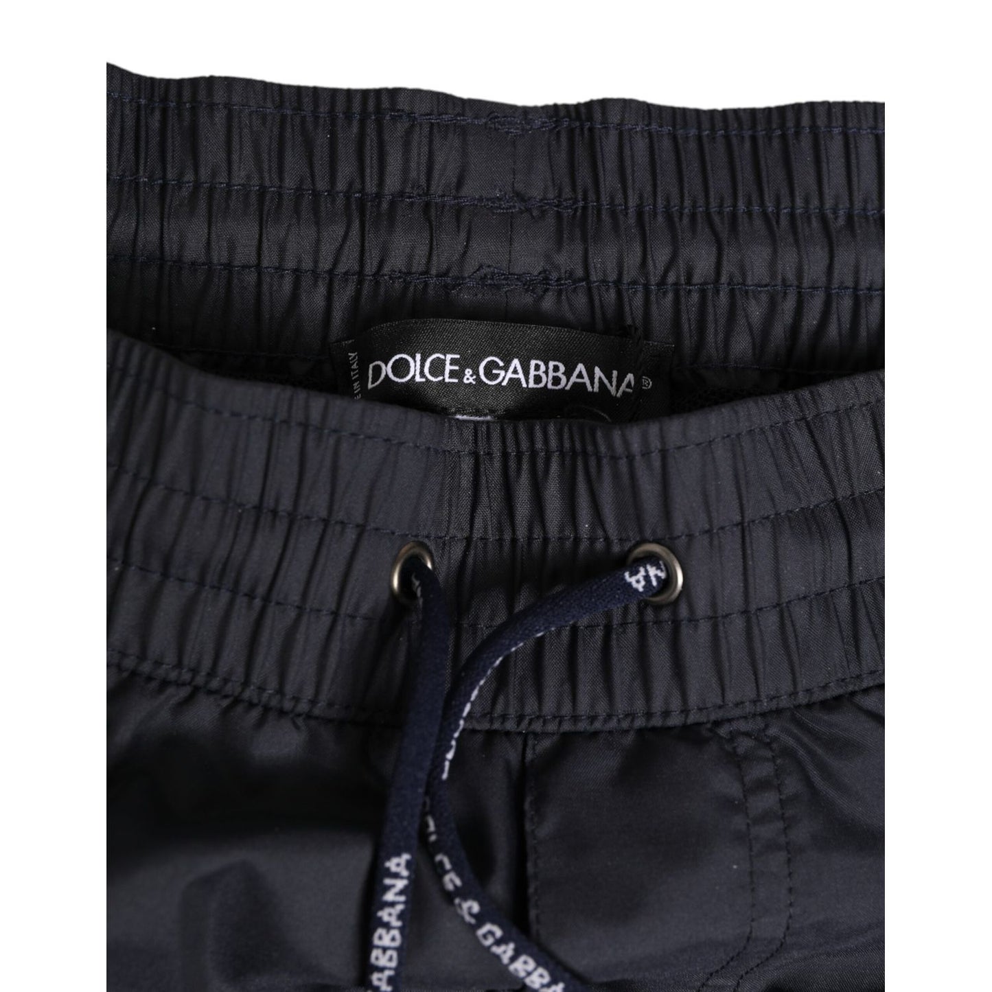 Close-up of Dolce & Gabbana Black White Polyester Logo Elastic Waistband Swimwear with drawstring.