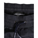 Close-up of Dolce & Gabbana Black White Polyester Logo Elastic Waistband Swimwear with drawstring.